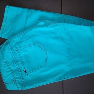 Neon turquoise ripped skinny jeans